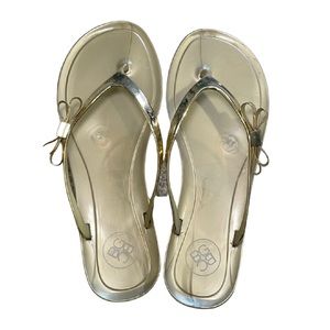 BGBGeneration gold flat jelly thong sandals with gold bow accent